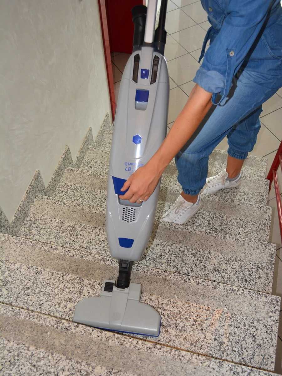 Lindhaus LB3 commercial vacuum cleaning carpeted stairs in use