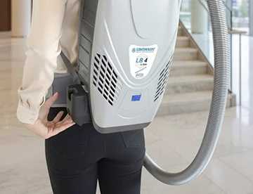 Lindhaus LB4 L-ion Superleggera backpack vacuum worn on stairs