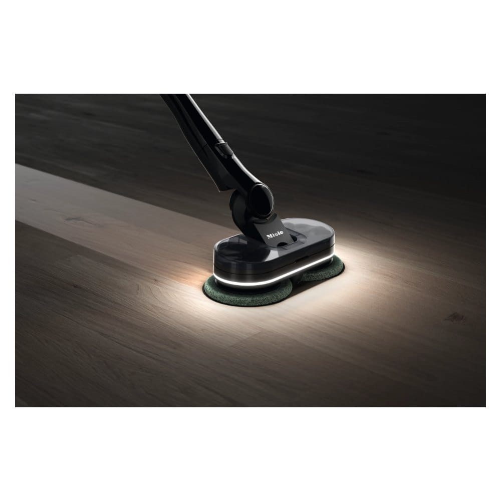 Miele Triflex HX3 AquaTwister 360 SpotLight Miele AquaTwister 360-degree SpotLight lighting a dark floor